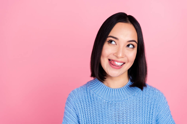 Portrait of cheerful pretty person tongue lick teeth look interested empty space isolated on pink color background. - Foto, Bild