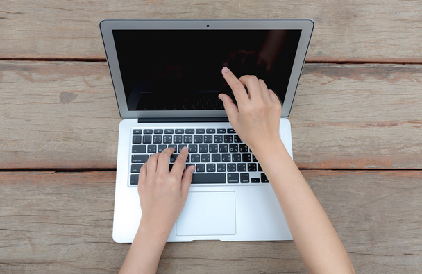 Closeup of business woman hand typing on laptop keyboard - Foto, imagen