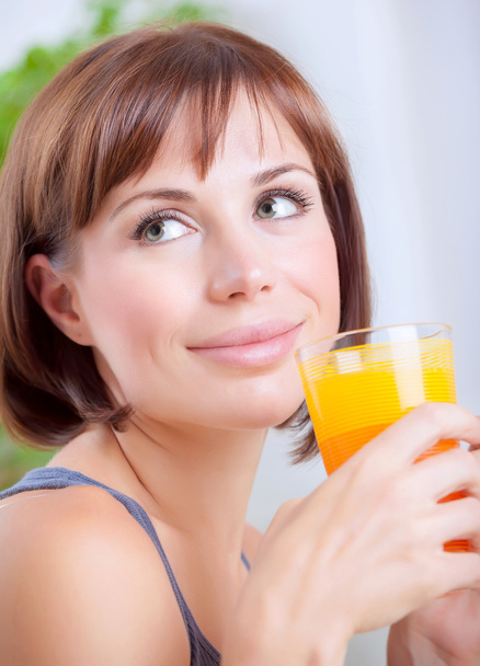 Cute female drinking juice - Фото, изображение