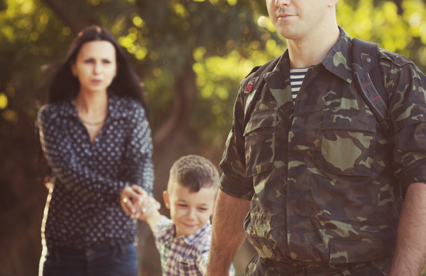 Family and soldier in a military - Photo, Image