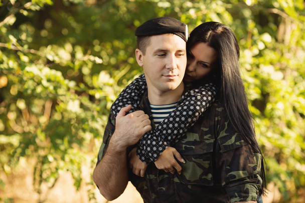 Woman and soldier embracing - Photo, Image