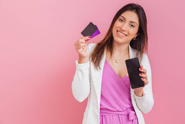 beautician doctor, businesswoman, entrepreneur, holding cellphone and credit cards. payment methods, online shopping. - Fotó, kép