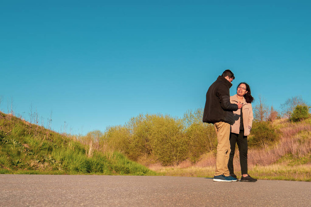 Couple standing on a countryside road near Copenhagen in Denmark - Photo, Image