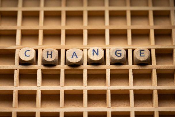 Change. Wooden dice arranged in a box, to the word change. Future, life and mindset. - Foto, Bild