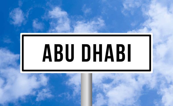 Abu dhabi road sign on sky background - Fotó, kép