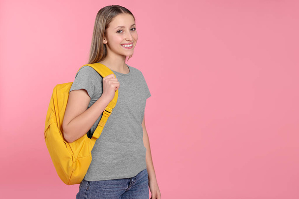 Teenage girl with backpack on pink background. Space for text - Fotografie, Obrázek