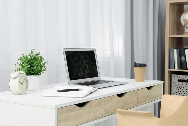 Workplace with modern laptop on desk at home - Foto, Imagem