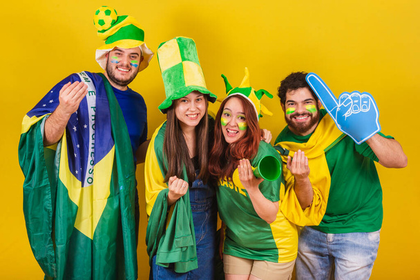 group of friends, soccer fans from brazil, using brazil flag, calling with hands, come. be welcome. inviting. - Photo, Image