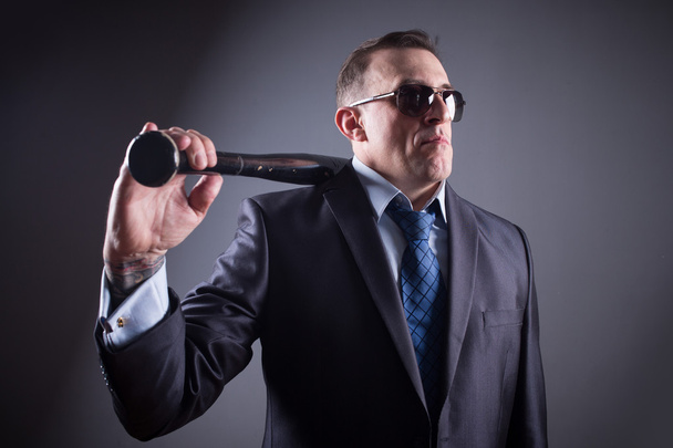 male gangster with glasses and a baseball bat - 写真・画像