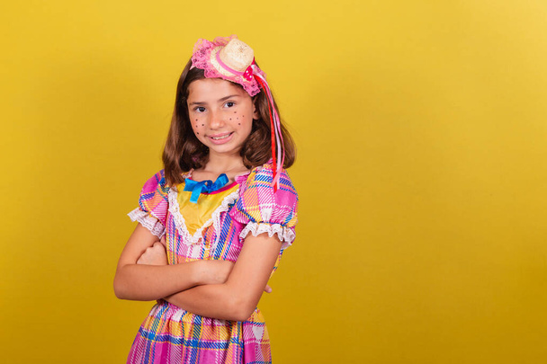 Brazilian, caucasian, child, dressed for festa junina, arms crossed, confident, smiling, happy - Foto, immagini