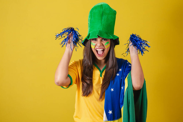 Close-up photo, Woman supporter of Brazil, world cup 2022, cheering with pompoms. - Fotoğraf, Görsel