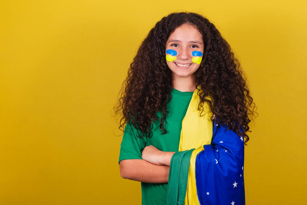 Brazilian girl, Caucasian, football fan, Arms crossed, optimistic, positive. - Фото, зображення