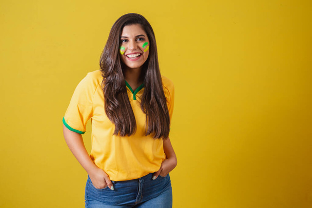 Woman supporter of Brazil, world cup 2022, football championship, hands in pockets smiling. - Φωτογραφία, εικόνα