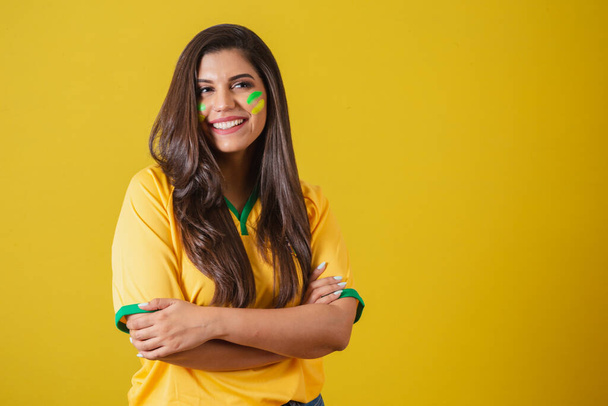 Woman supporter of Brazil, world cup 2022, football championship, Arms crossed, smiling. - Фото, изображение