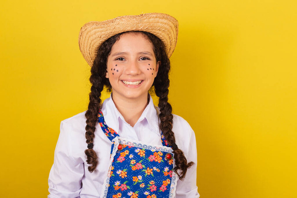 Girl wearing typical clothes for Festa Junina. close-up photo, smiling and happy. For the Festival do Arraia - Fotó, kép