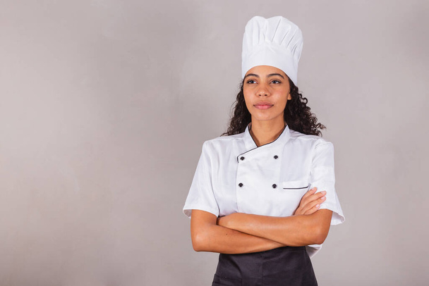young black brazilian woman, cook, masterchef. With arms crossed. - Zdjęcie, obraz