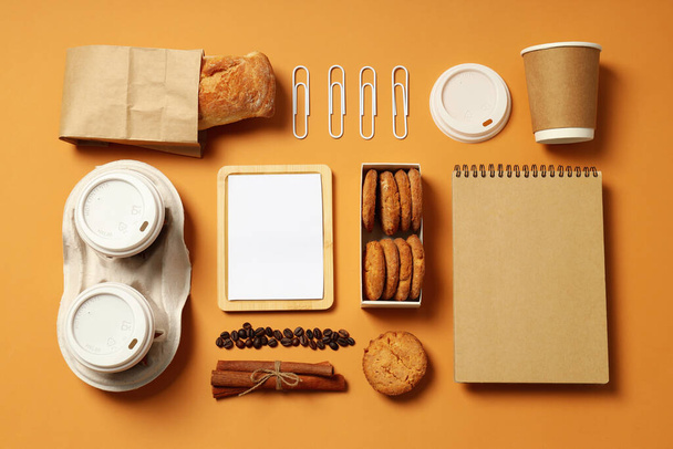 Mockup flat lay with freelancer accessories on beige background - 写真・画像