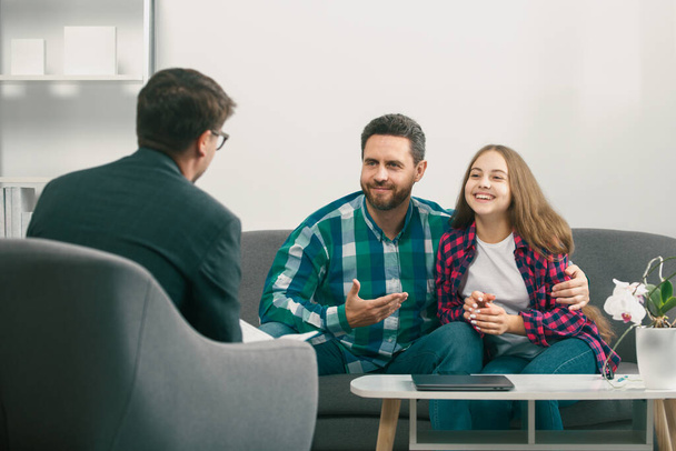 Parents telling the psychologist about family or child problems. Family psychologist. Psychotherapy with father and and daughter tenager - Фото, зображення