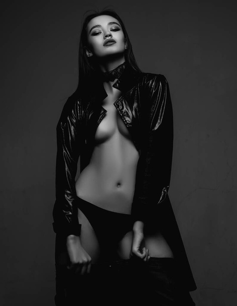 Young and free. woman in black latex leather coat. Desire. makeup and hair style. Sensual woman. Beauty and fashion. trendy look. Sexy girl. fit and sexy belly. Fresh funky beauty. - Φωτογραφία, εικόνα