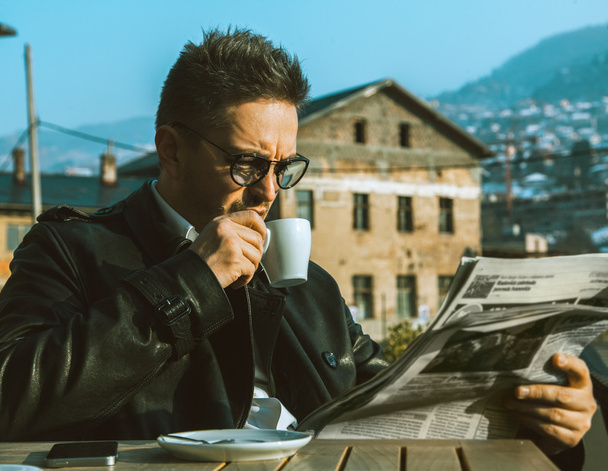 Beautiful adult business man drink coffe and read newspaper  - Foto, immagini