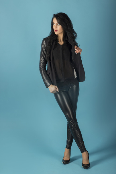 brunette in a black jacket - Фото, зображення