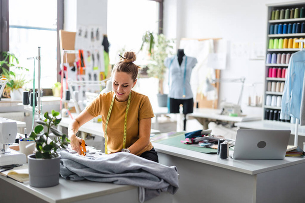 Young fashion designer working at her workplace - Foto, Imagem