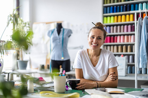 Young fashion designer working at her workplace - Photo, Image