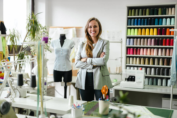 Young fashion designer working at her workplace - Foto, Bild