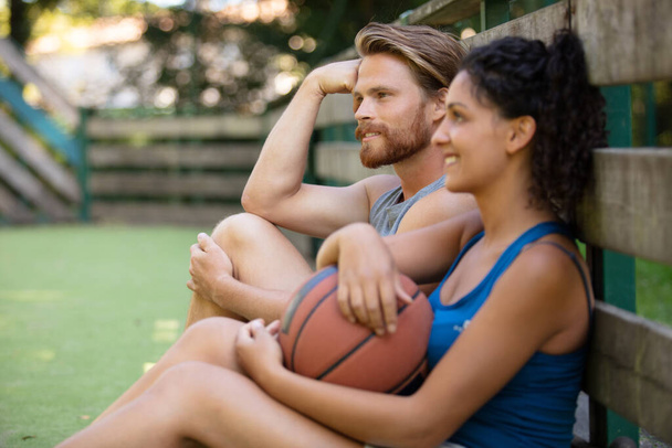 happy couple having a basketball break - Foto, imagen