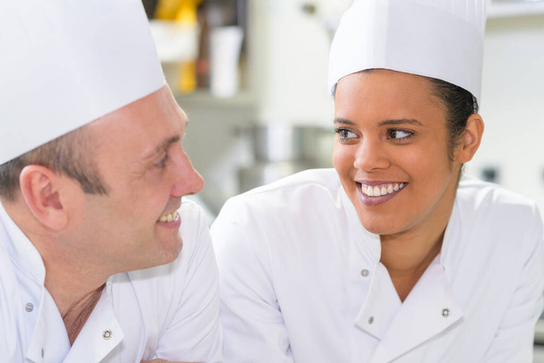 portrait of the woman and man in a professional kitchen - Photo, image
