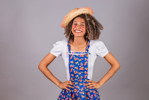 Young black Brazilian woman, with country clothes, dressed for Festa Junina. Saint John's festival. Hands on hips. - Φωτογραφία, εικόνα