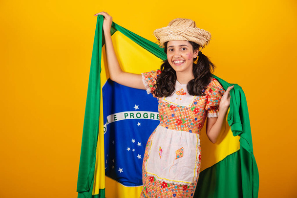 brazilian woman, with clothes of festa junina, with flag of brazil - Fotografie, Obrázek