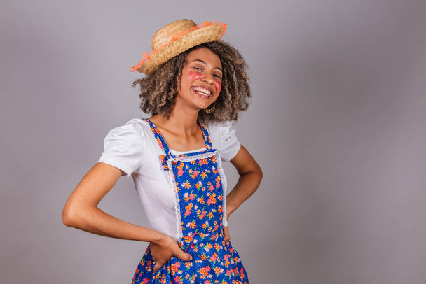 Young black Brazilian woman, with country clothes, dressed for Festa Junina. Saint John's festival. Hands on hips. - Fotografie, Obrázek