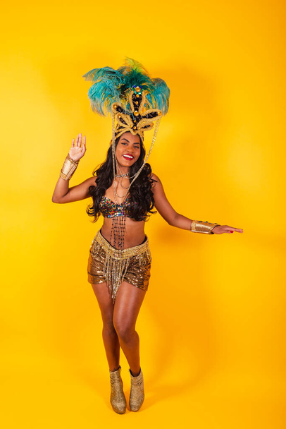 Vertical photo, full body, Black Brazilian woman in carnival clothes posing for a photo. - Photo, Image