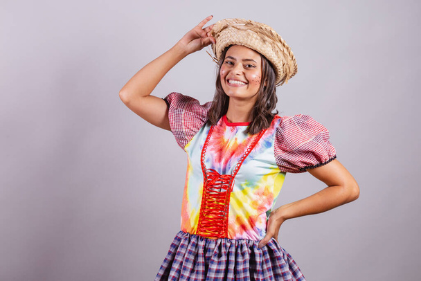 Brazilian woman wearing country clothes, So Joo party, Junina party. hands on waist and hat  - 写真・画像