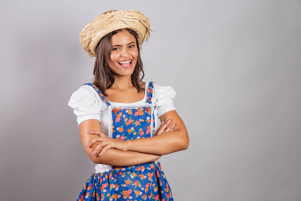 Brazilian woman wearing country clothes, So Joo party, Junina party. crossed arms. smiling.  - Photo, Image