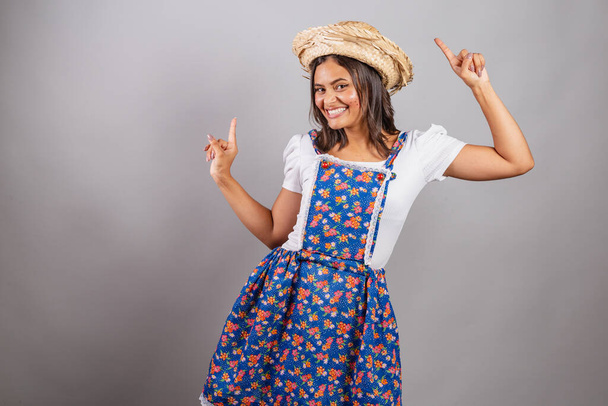 Brazilian woman wearing country clothes, So Joo party, Junina party. Dancing.  - Photo, image