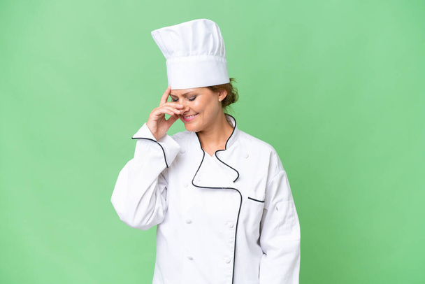 Middle-aged chef woman over isolated background laughing - Photo, Image