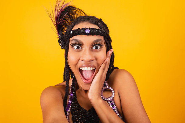 beautiful black Brazilian woman, in purple carnival clothes, taking self portrait. - Zdjęcie, obraz