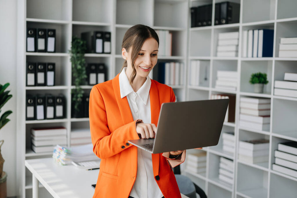 Confident Businesswoman using  laptop  in office - Foto, immagini