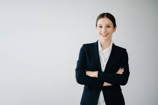 Smiling caucasian young businesswoman  looking at camera  isolated in white background - Fotografie, Obrázek