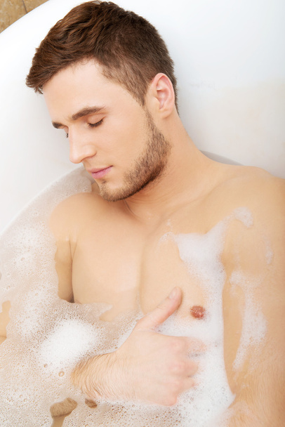 Handsome man taking a bath. - Foto, Imagem