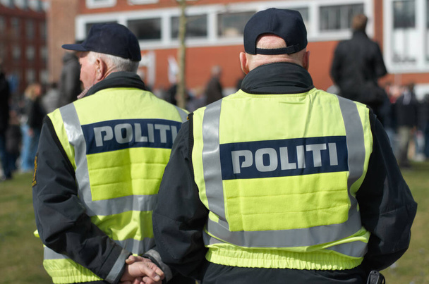 Safety, protection and security with police officer in city for peace, law enforcement and authority. Emergency services, justice and guard with person in street for enforcement, order and arrest. - Foto, Bild