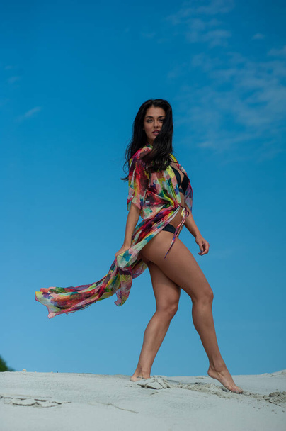 beautiful young woman in swimwear posing on beach - Фото, зображення