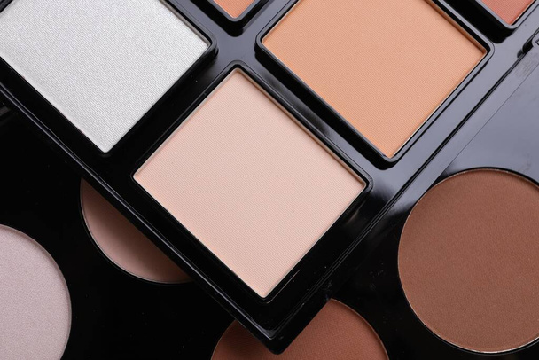 Colorful contouring palettes as background, closeup. Professional cosmetic product - Φωτογραφία, εικόνα