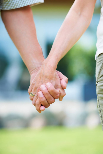 Were in this together. Cropped image of a couple holding hands - Фото, зображення