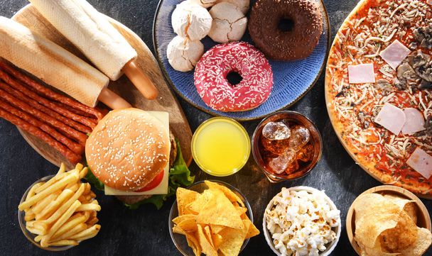 Foods enhancing the risk of cancer. Junk food - Foto, afbeelding
