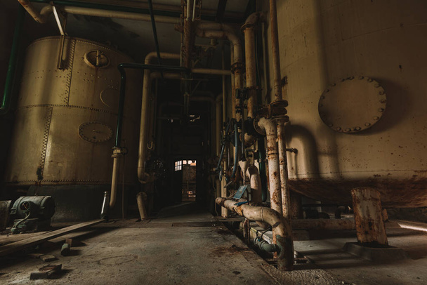 Old and rusty abandoned industrial plant, forgotten historical factory, Lost Place - 写真・画像