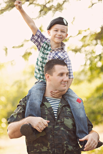 Boy and soldier in a military uniform - Photo, Image