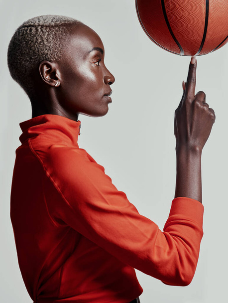 Skill like hers cant be taught. Studio shot of an attractive young woman playing basketball against a grey background - Фото, зображення